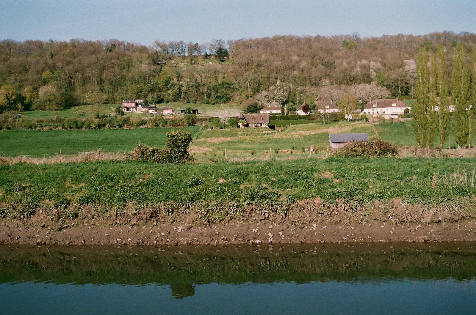 rural houses near lake in countryside